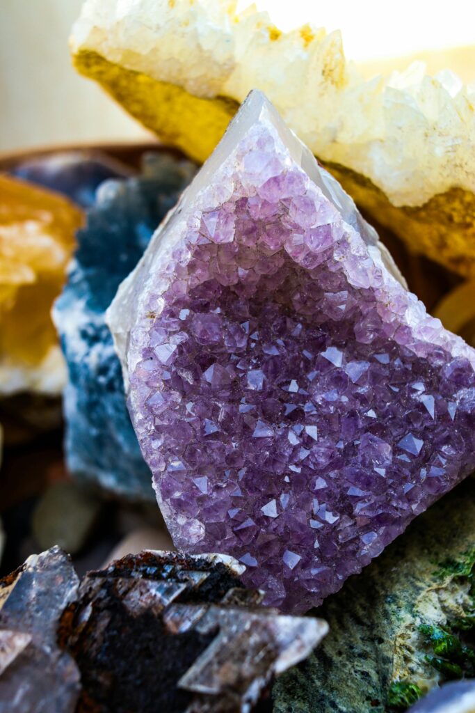 Close-up of vibrant amethyst crystal clusters with diverse mineral textures.