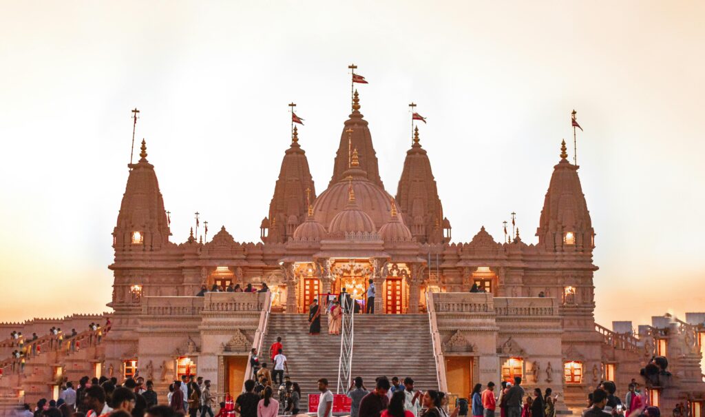 Stunning view of BAPS Swaminarayan Mandir in India at sunset, architectural marvel.