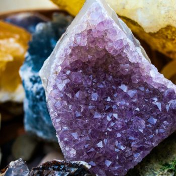 Close-up of vibrant amethyst crystal clusters with diverse mineral textures.